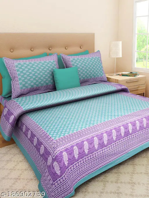 Pure cotton printed double bedsheet with 2 pillow covers, breathable material for comfortable summer sleep. Vibrant ethnic motifs in inviting colors, machine washable, cozy and stylish bedding for a warm and charming decor. Handcrafted quality from India