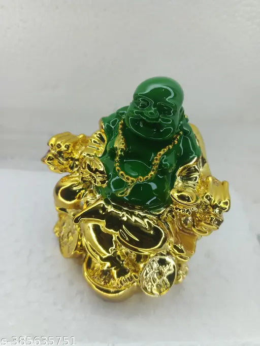 Laughing Buddha home decor figurine, green and gold, sitting on sofa