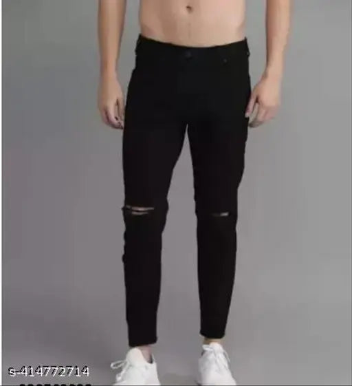 Black denim jeans with knee cut detail, men's monk fit from Shriradhe Enterprises. Solid black color, ideal for casual outings or everyday wear
