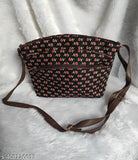 The image shows a stylish sling bag with five visible chains, designed by ikkat. It features a red floral pattern and is presented against a neutral background. The bag appears to be made of leather or a similar material