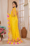 Bright yellow mirror work saree with pink and beige details