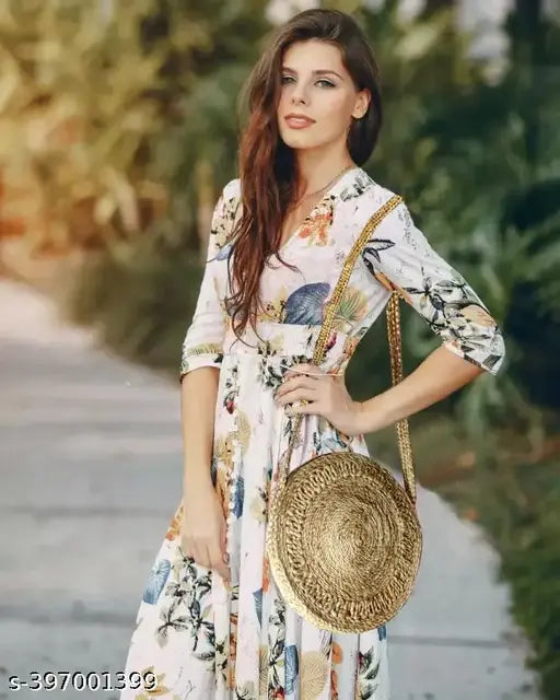 Woman wearing a sleeveless dress, posing outdoors in the sun with a sling bag