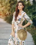 Woman wearing a sleeveless dress, posing outdoors in the sun with a sling bag