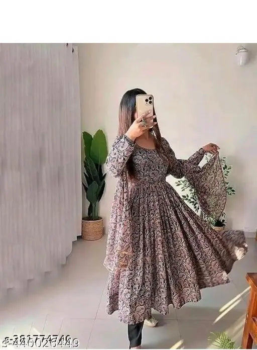 Maoon color georgette gown, long sleeves, printed net, faux Georgette with rich digital print, full sleeves, round neck, cotton lining. Size: L (Bust 40in, Length 50in, Waist 42in), XL (Bust 42in, Length 50in, Waist 44in), XXL (Bust 44in, Length 50in, Waist 46in). Made in India