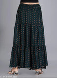Green printed rayon long skirt for women, vibrant pattern on display stand