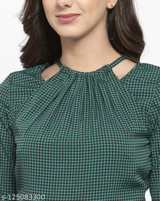 Women's green and black houndstooth print crepe jumpsuit with three-quarter sleeves, halter neck design on model