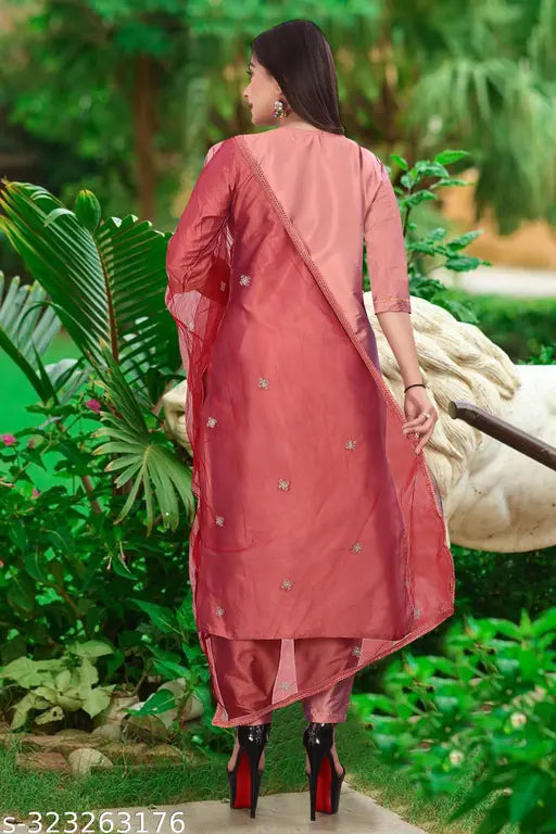 Art silk embroidered kurta set with pant and dupatta, three-quarter sleeves, round neck, side slit. Silk blend fabric for party wear comfort. India origin