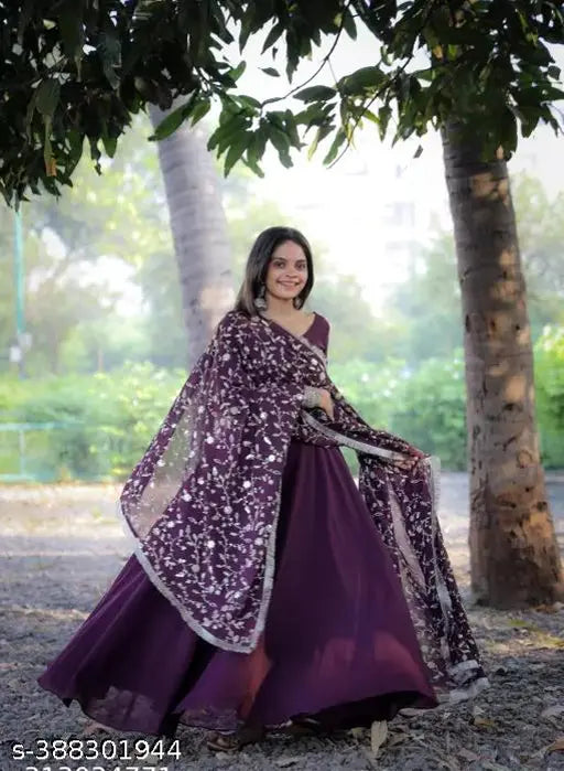 Woman wearing purple anarkali kurta set with dupatta
