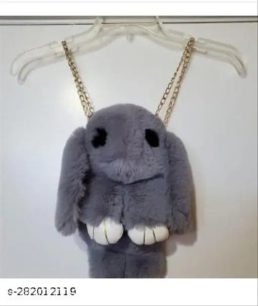 Animal print bunny sling bag, shoulder bag, back pack. Grey plush toy attached by string. Black strap