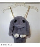 Animal print bunny sling bag, shoulder bag, back pack. Grey plush toy attached by string. Black strap