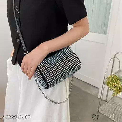 Black polka dot sling bag with chain strap