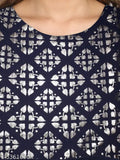 Navy and black patterned blouse with cold-shoulder design