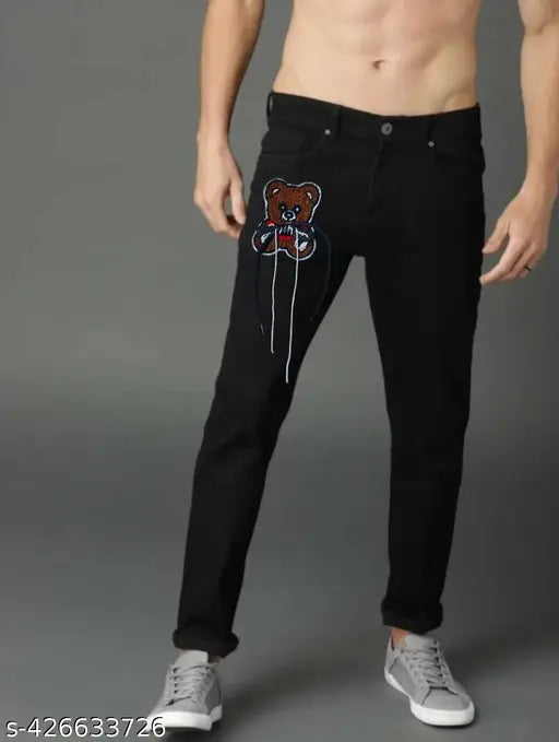Men's blue denim jeans with teddy bear graphic, black pants