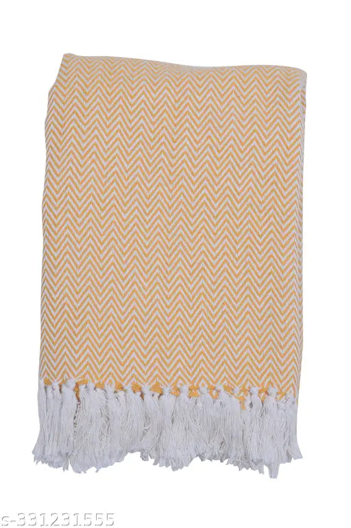 Yellow fringe throw blanket with a chevron pattern