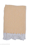 Yellow fringe throw blanket with a chevron pattern