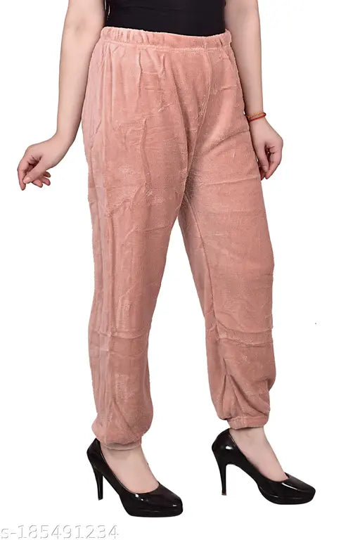 Pink unstitched loose-fitting pants, sleeveless top, high waist