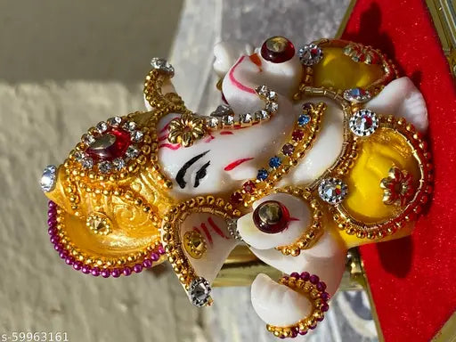 Multi-colored polyresin Ganesha idol for home decor and car dashboard, handcrafted with religious symbolism for Diwali gifting or room decoration