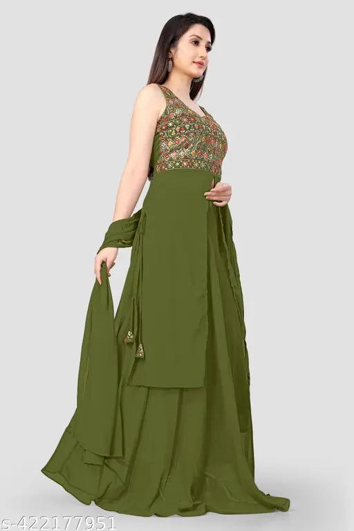 A woman in a sleeveless, green, embroidered kameez with a matching dupatta