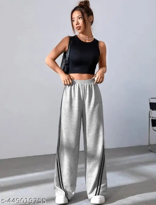 Grey track pants with a black crop top