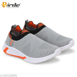 Grey knit sports shoes with orange accents, designed for boys