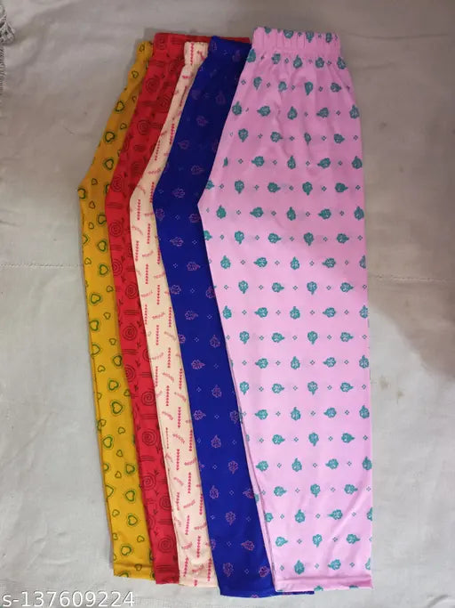 Colorful pajama set with multiple patterns and materials, suitable for a child's closet