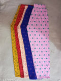Colorful pajama set with multiple patterns and materials, suitable for a child's closet
