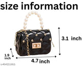 Small clutch purse with chain strap, featuring a black fabric body and clear plastic body lining