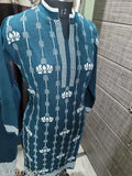 A blue kameez with intricate paisley design and matching dupatta