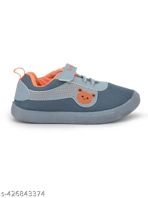 Little kid's shoes with blue fabric and orange bear logo