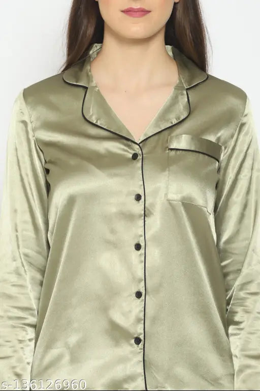 Green satin pyjama set for women, solid design with long sleeves and matching shirt on hangar