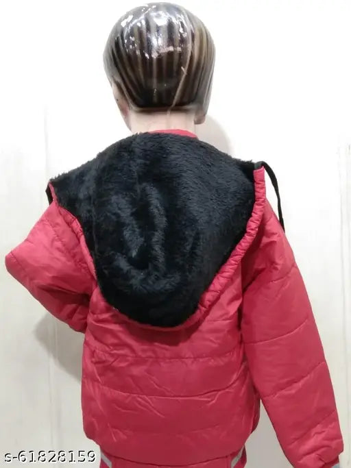 The image shows a boy wearing a red jacket with a black hoodie. The jacket appears to be fluffy and warm, suggesting it might be a winter or cold-weather garment