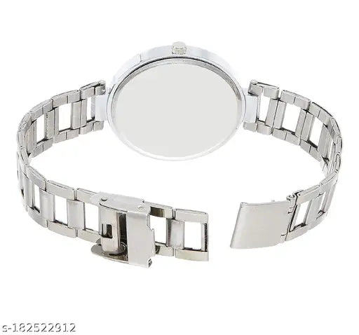 Silver watch with white face and clear back, worn by woman