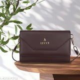 Black leather sling bag with long strap, gold logo