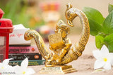 Gold oxidized metal sitting baby Ganesh idol statue with peacock and book for Puja, measures 15x7x15.5 cm, ideal showpiece for home or office