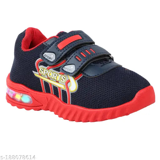 Black velvet boys' or girls' sports running shoes with red details and Velcro straps