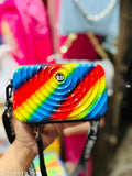 Colorful plastic purse with rainbow design, rectangular shape