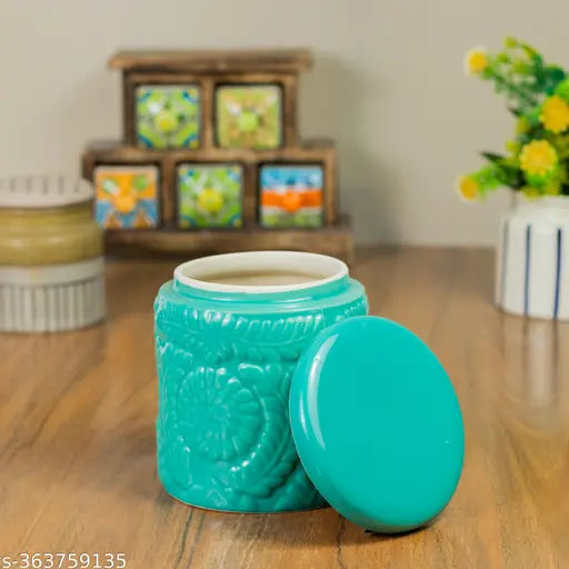 Pink and green ceramic jar set, holding a coffee cup