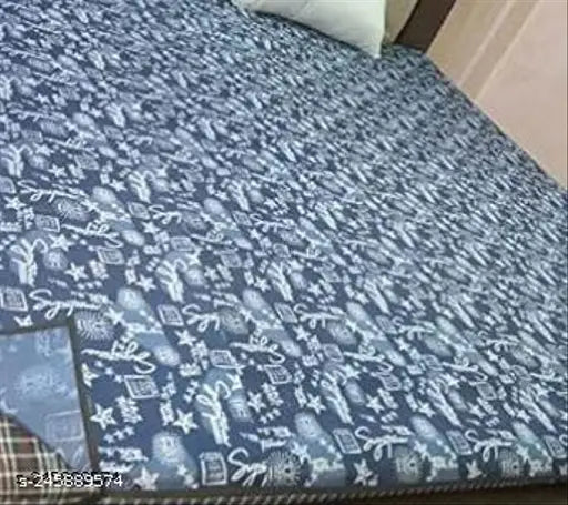 Blue printed, 200 GSM terry cotton feel PVC mattress protector for baby's king size bed. Waterproof, elastic, and breathable for hygienic and durable sleep solution