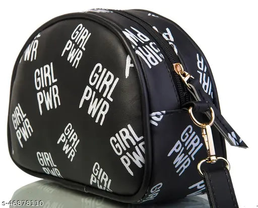 Elegant black leather slingbag with adjustable strap and zip closure, featuring a bold white graphic print
