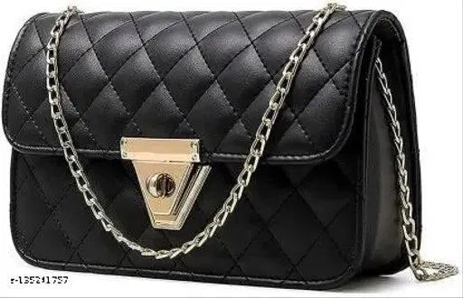 Black crossbody bag with multiple straps and metal chain links