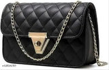 Black crossbody bag with multiple straps and metal chain links