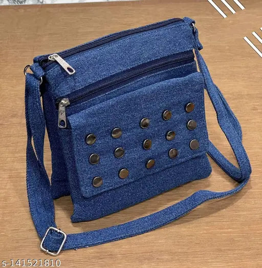Denim sling bag with studded details, blue denim material