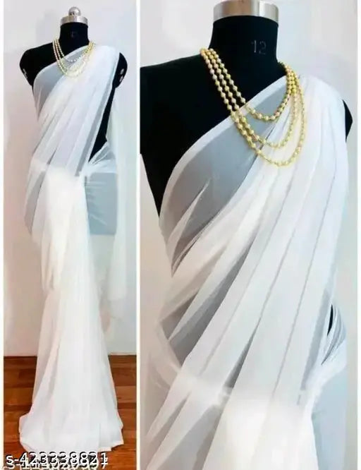 White traditional sari with pallu, adorned with pearl necklace