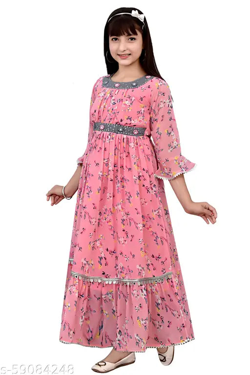 Pink cotton blend embroidered three-quarter sleeve gown for girls, intricate stitching detail, comfortable fit, round neckline, long pleated skirt, bow at back, India origin