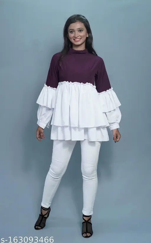 Crepe layered top with colorblocked net pattern, long sleeves, and button closure. Indian-made, attractive design available in sizes XS-XXXL