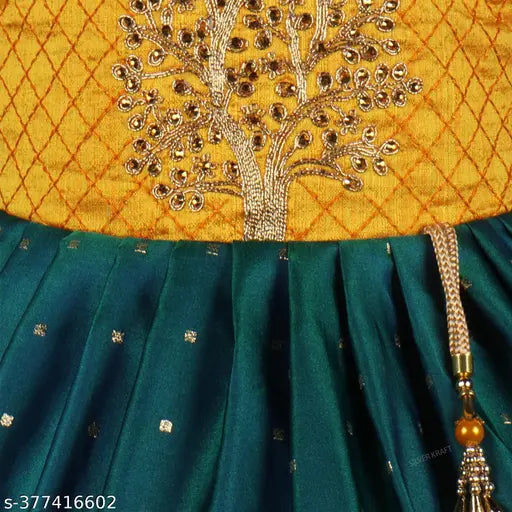 Bottle green satin frock dress for girls with silver kraft embroidery, yellow and green color scheme, tassel detail, and zipper closure