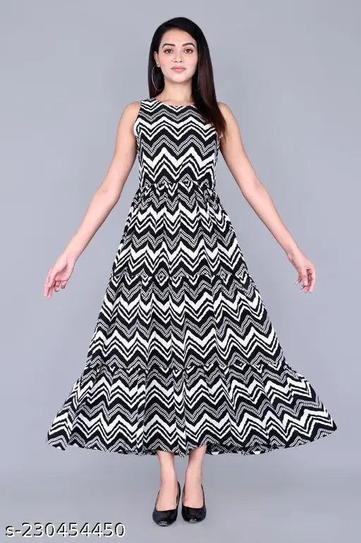The woman is wearing a chevron patterned mid-length, sleeveless dress