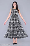 The woman is wearing a chevron patterned mid-length, sleeveless dress