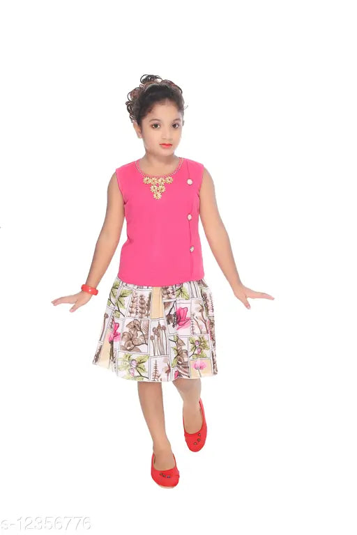 Pink sleeveless top, multicolor patterned skirt