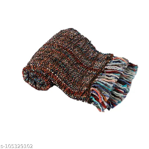 Multicolored knitted blanket with tassels on a white background
